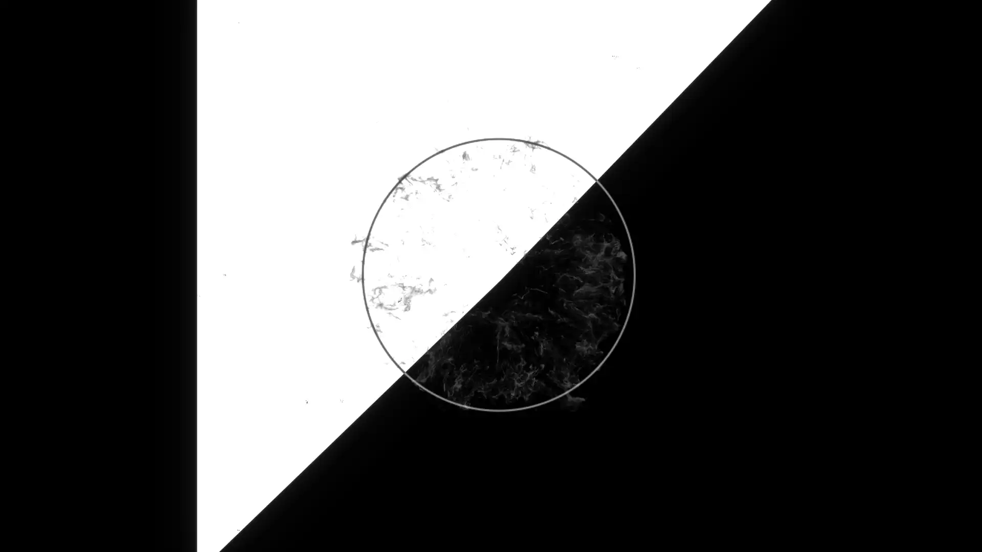 still image from the demo reel showing motion graphics in black and white. The middle of the mostly black frame is diagonally sliced with a white trangle. The middle has a circle outline and some cloud like details inside it.